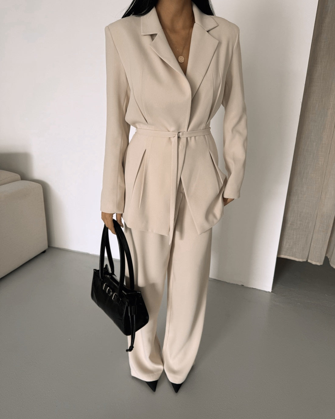 Belted Featuring pleats at the waist