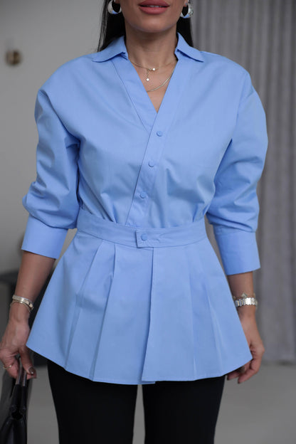 Two-piece shirt (wrappable like a skirt) in white poplin fabric with an elegant design