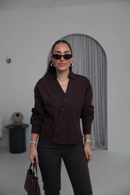 Two-piece shirt (wrappable like a skirt) in white poplin fabric with an elegant design