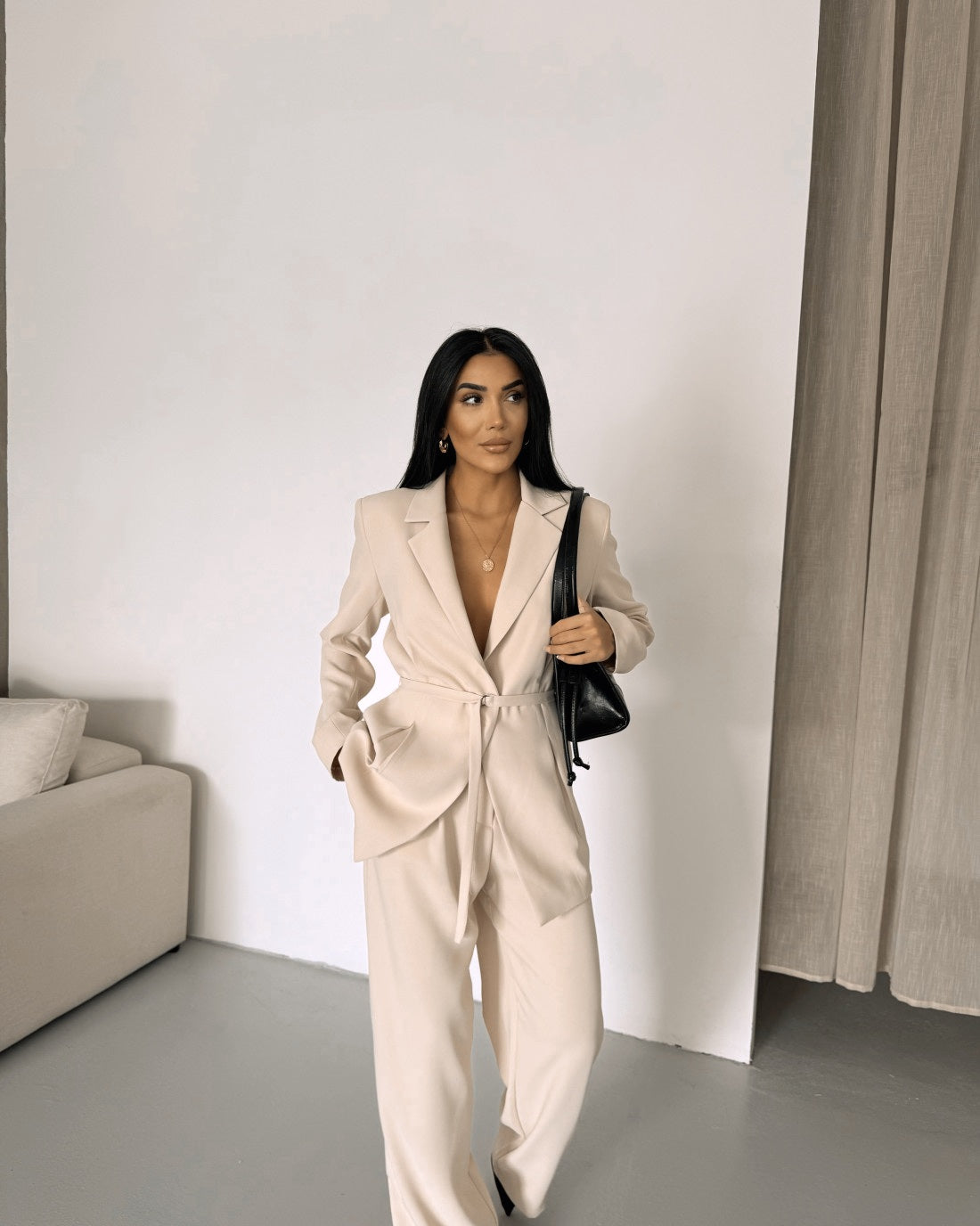 Belted Featuring pleats at the waist