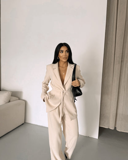 Belted Featuring pleats at the waist