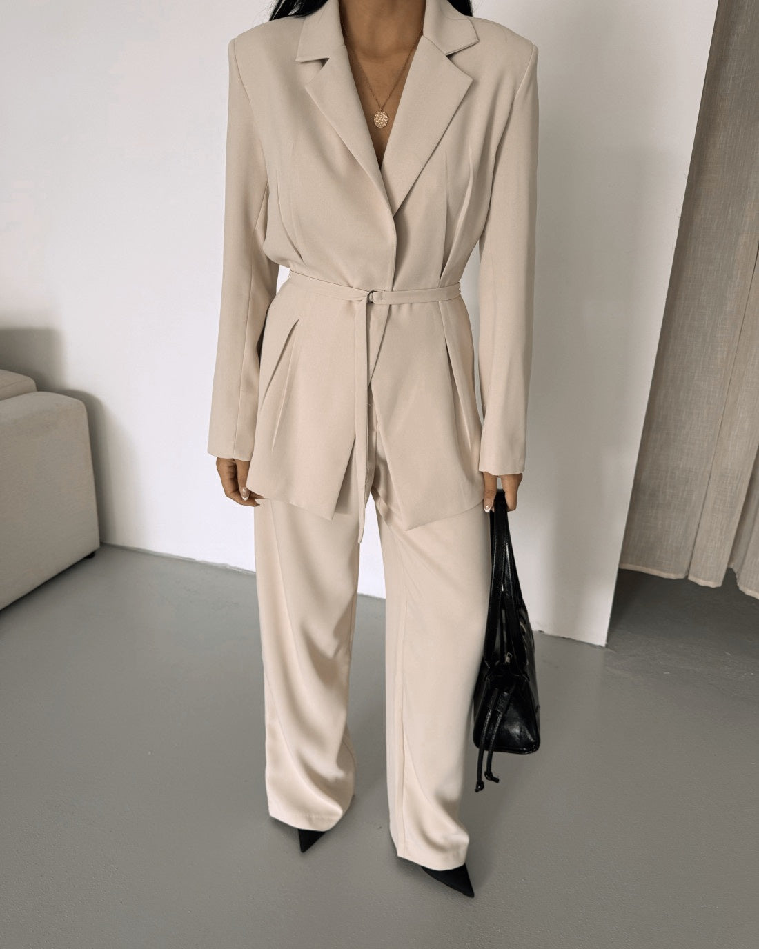 Belted Featuring pleats at the waist