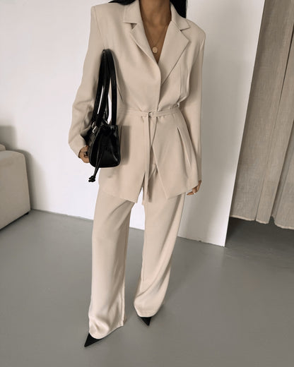 Belted Featuring pleats at the waist