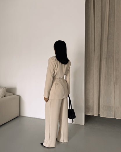 Belted Featuring pleats at the waist