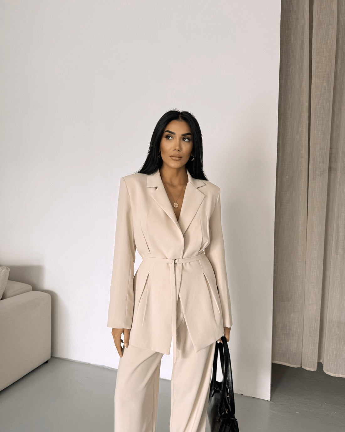 Belted Featuring pleats at the waist