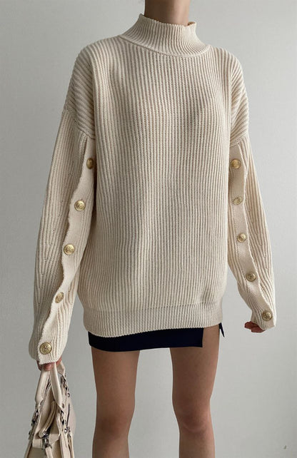 Knitted blouse with buttons on sleeves