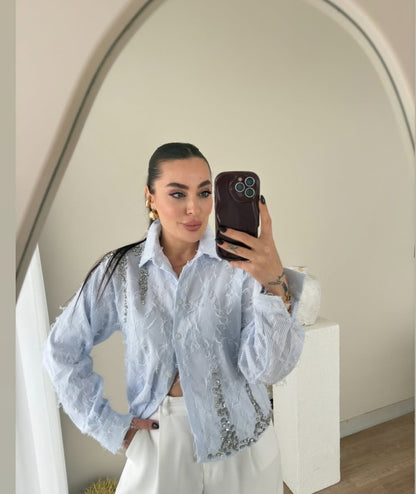 Feathered shirt with rhinestone details