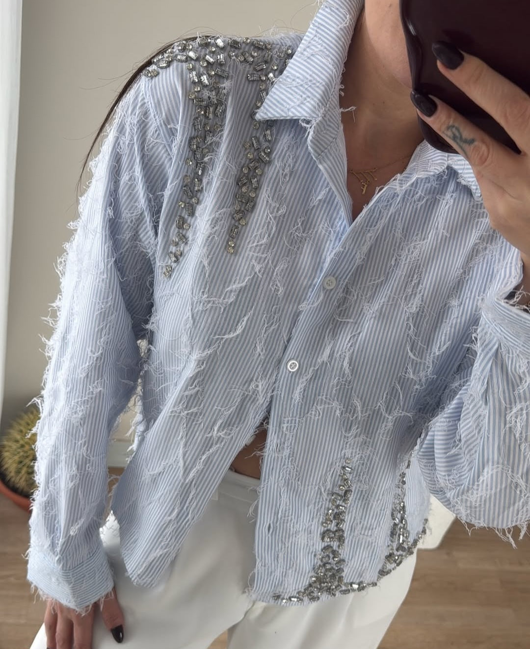 Feathered shirt with rhinestone details