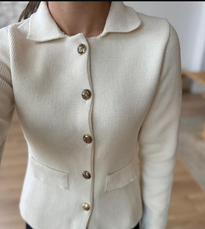 Knitted jacket with gold buttons