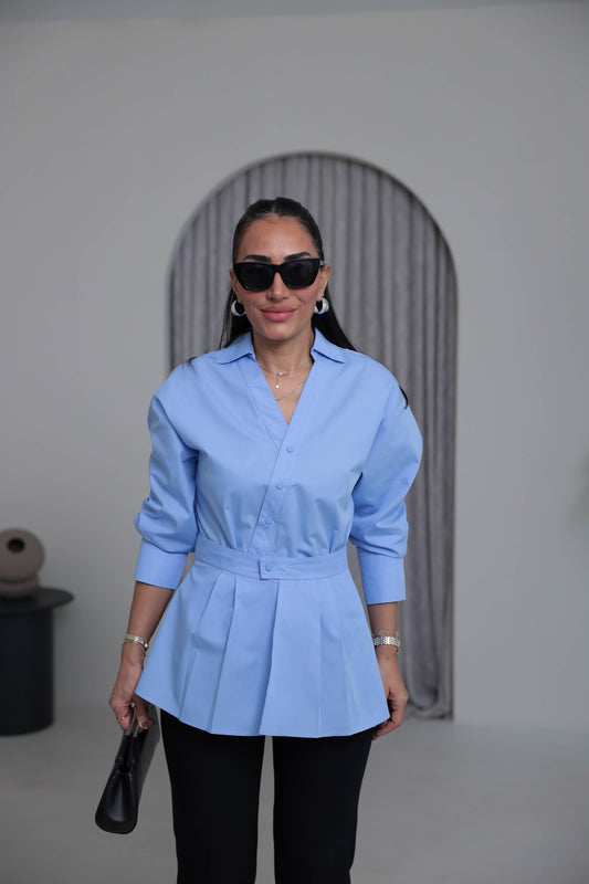 Two-piece shirt (wrappable like a skirt) in white poplin fabric with an elegant design