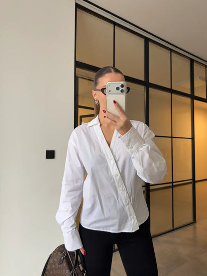 Two-piece shirt (wrappable like a skirt) in white poplin fabric with an elegant design