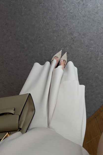 Zara model Loose-fitting top with crew neck  ,Flowing mid-waist midi skirt with an asymmetric hem.